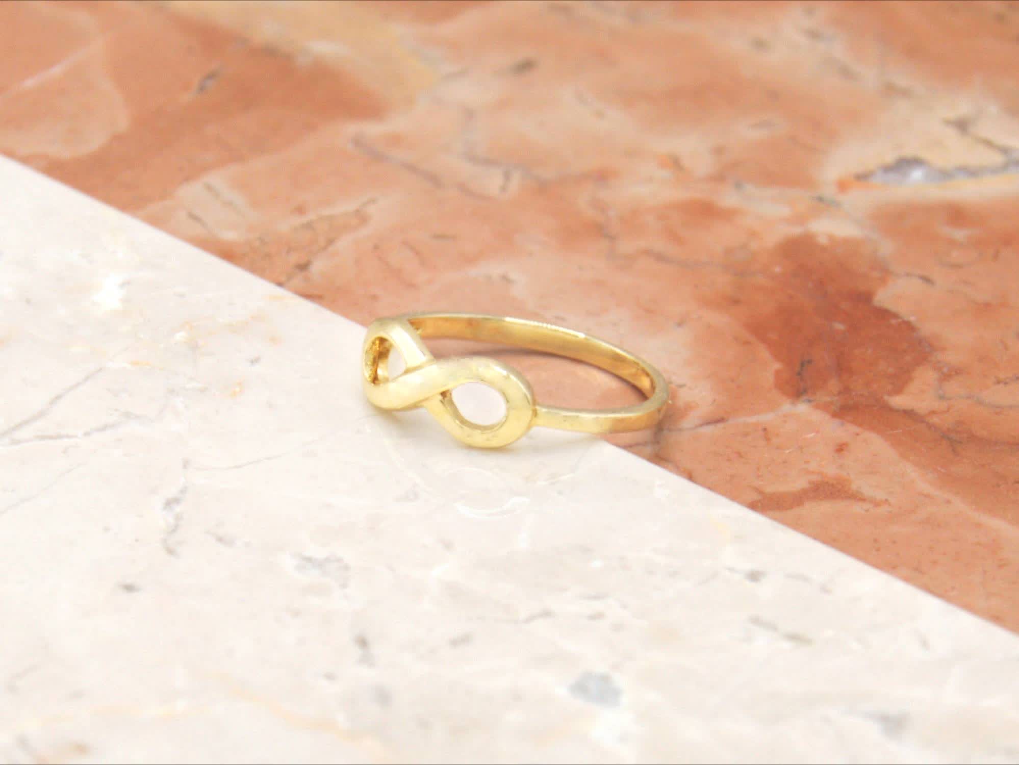 Anello oro giallo simbolo infinito